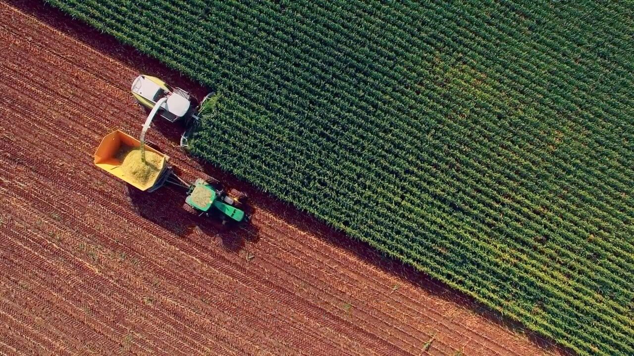 field with tractaor harvesting ingredients for biofuel production 